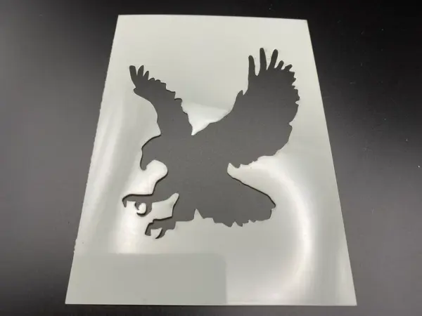 The Eagle Stencil Airbrushing Laser Cut Wall Art features a detailed American eagle, perfect for airbrushing, painting, or creating dramatic wall art and baking designs. Ideal for adding a bold USA-inspired touch to any project.